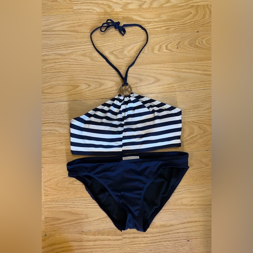 Michael Kors navy and white striped bikini set with a logo-accented halter top.